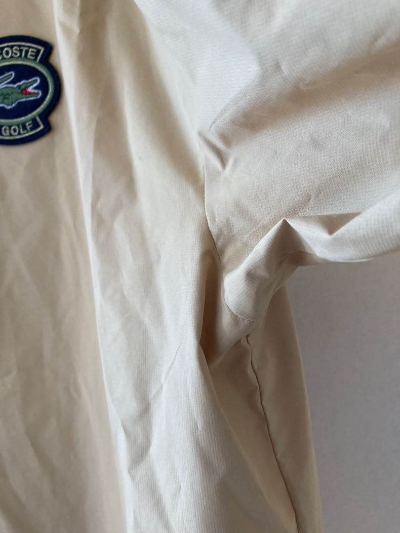LACOSTE　ゴルフウェア　Vネックウィンドブレイカー　サイズUSのＬサイズ