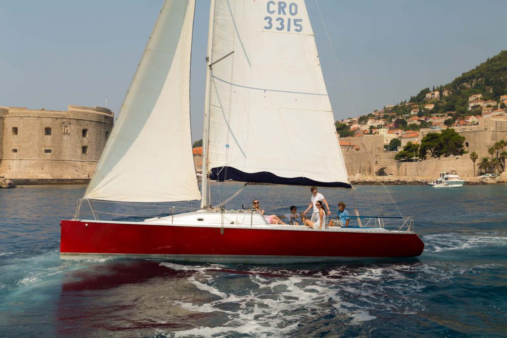 Red Sailboat in front of Old town Dubrovnik
